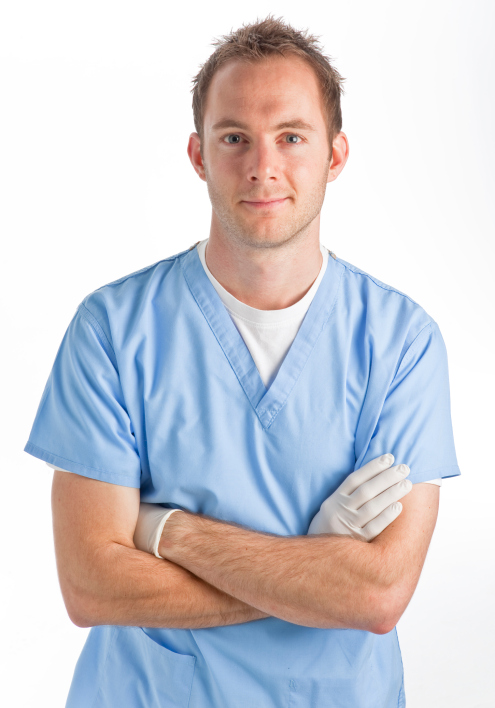Young male nurse wearing gloves